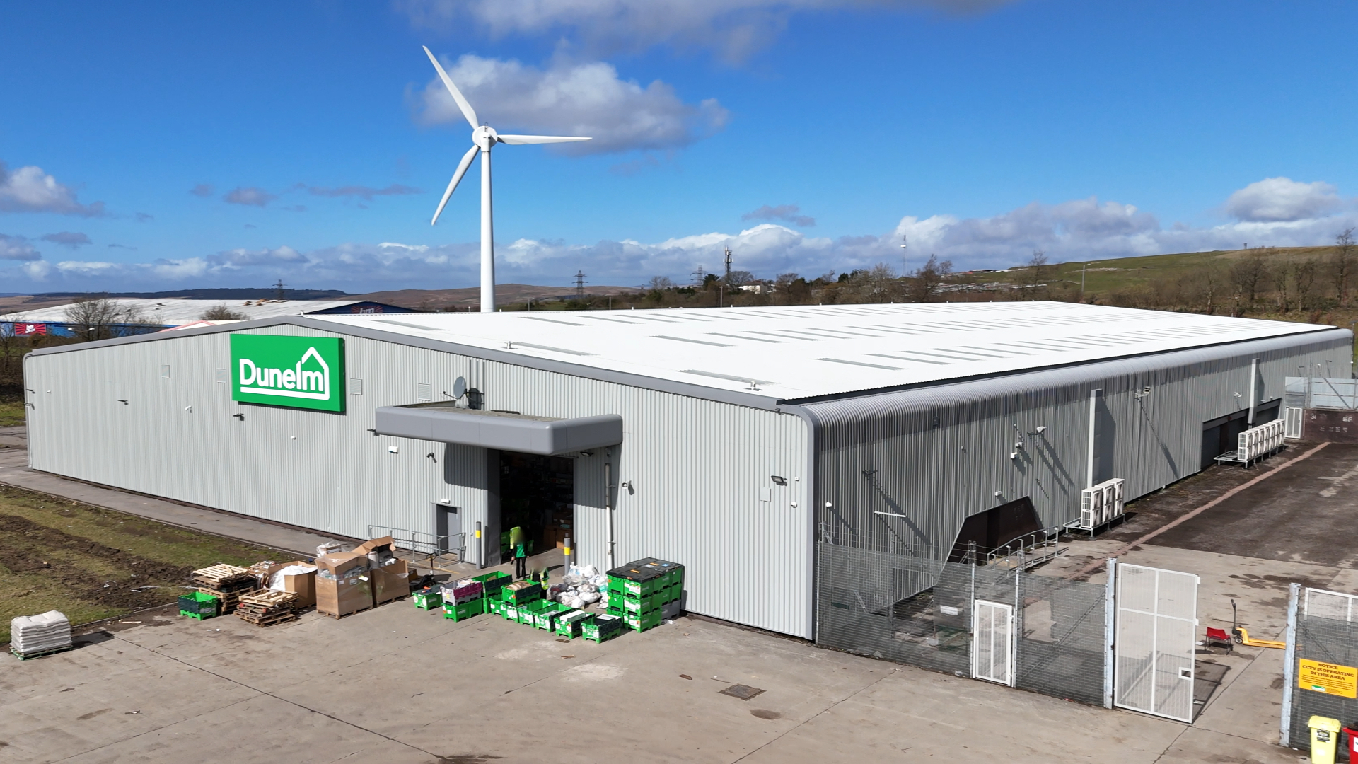 Refurbished roof and gutters at Dunelm Merthyr Tydfil with new insulation, rooflights, and mansafe safety system installed by Weatherproofing Advisors.